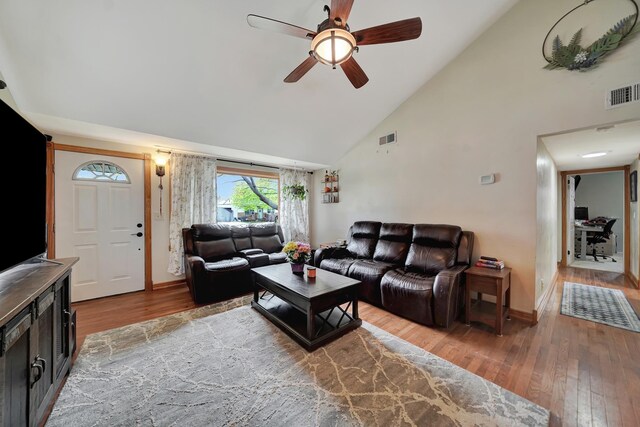 3317 N 9th St, Lincoln, NE 68521 - living area featuring wood finished floors, visible vents, high vaulted ceiling, and a ceiling fan