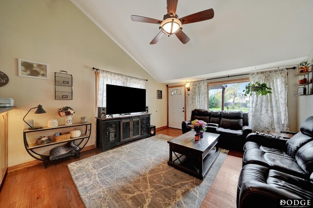 3317 N 9th St, Lincoln, NE 68521 - living area featuring high vaulted ceiling, baseboards, a ceiling fan, and wood finished floors