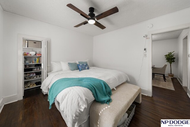 bedroom with wood-type flooring, baseboards, and ceiling fan