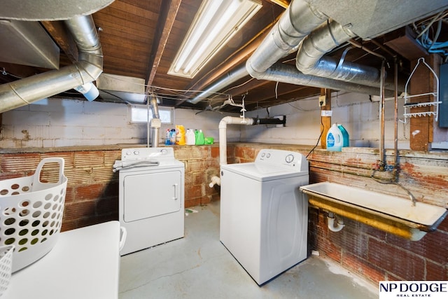 laundry area featuring washer and clothes dryer and laundry area