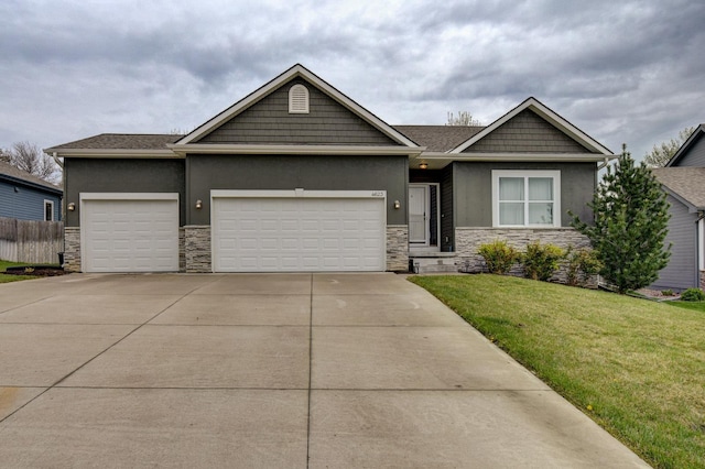 view of front of house featuring an attached garage, stucco siding, and stone siding