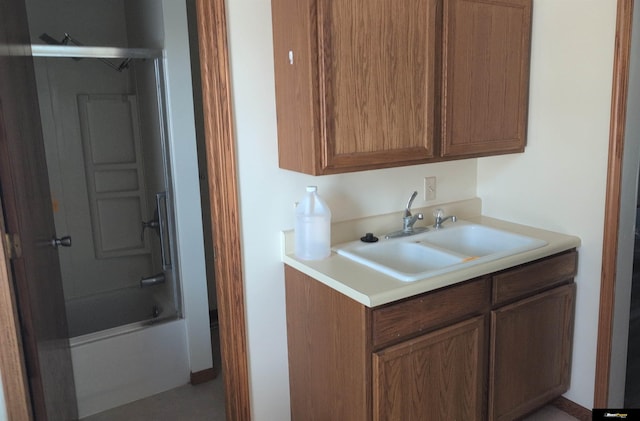 kitchen featuring light countertops and a sink
