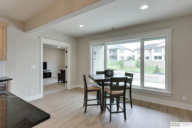 dining room featuring baseboards, recessed lighting, visible vents, and light wood-style floors