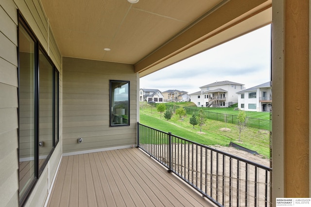 wooden deck featuring a residential view