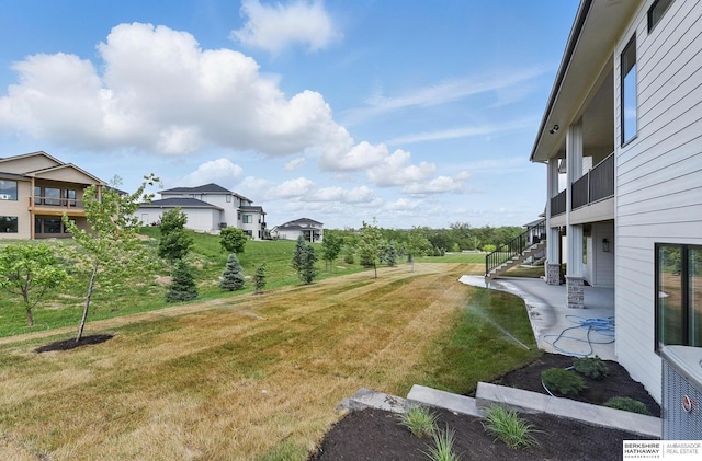21014 E St, Elkhorn, NE 68022 - view of grassy yard featuring stairway and a patio area