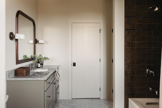 full bath featuring tile patterned floors, vanity, and shower / washtub combination