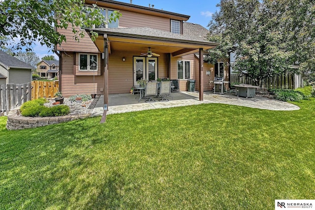 rear view of house featuring a patio and ceiling fan