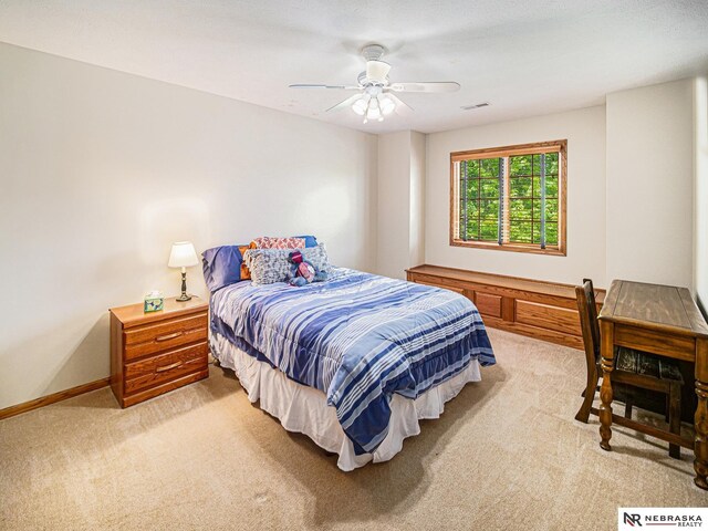 bedroom with light carpet, baseboards, and ceiling fan