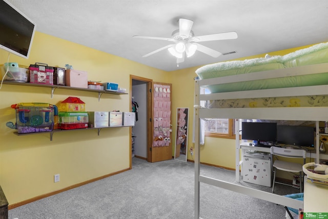 carpeted bedroom featuring baseboards, visible vents, and ceiling fan