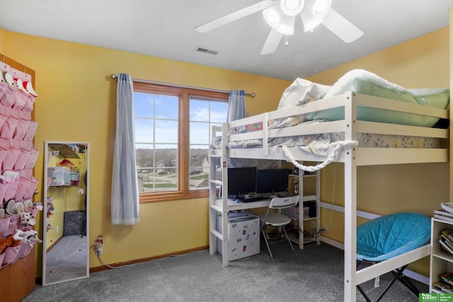 carpeted bedroom featuring ceiling fan, baseboards, and visible vents