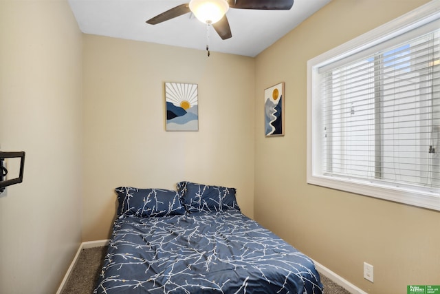 bedroom featuring ceiling fan, baseboards, and carpet flooring