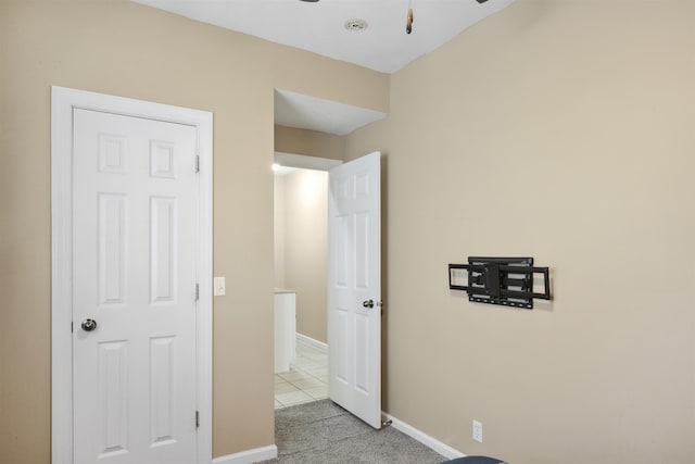 unfurnished bedroom with light colored carpet and baseboards