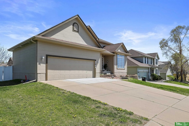view of front of house with an attached garage, driveway, a front lawn, and brick siding