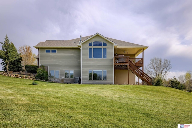 4510 W High Ridge Pl, Lincoln, NE 68522 - rear view of house featuring a ceiling fan, a yard, stairway, and a wooden deck