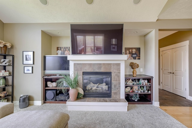 4510 W High Ridge Pl, Lincoln, NE 68522 - living room with a fireplace, a textured ceiling, and baseboards