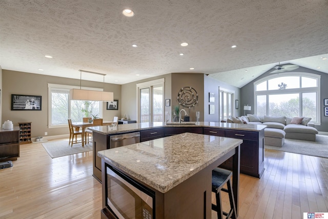 4510 W High Ridge Pl, Lincoln, NE 68522 - kitchen with open floor plan, stainless steel appliances, a kitchen island, and a wealth of natural light