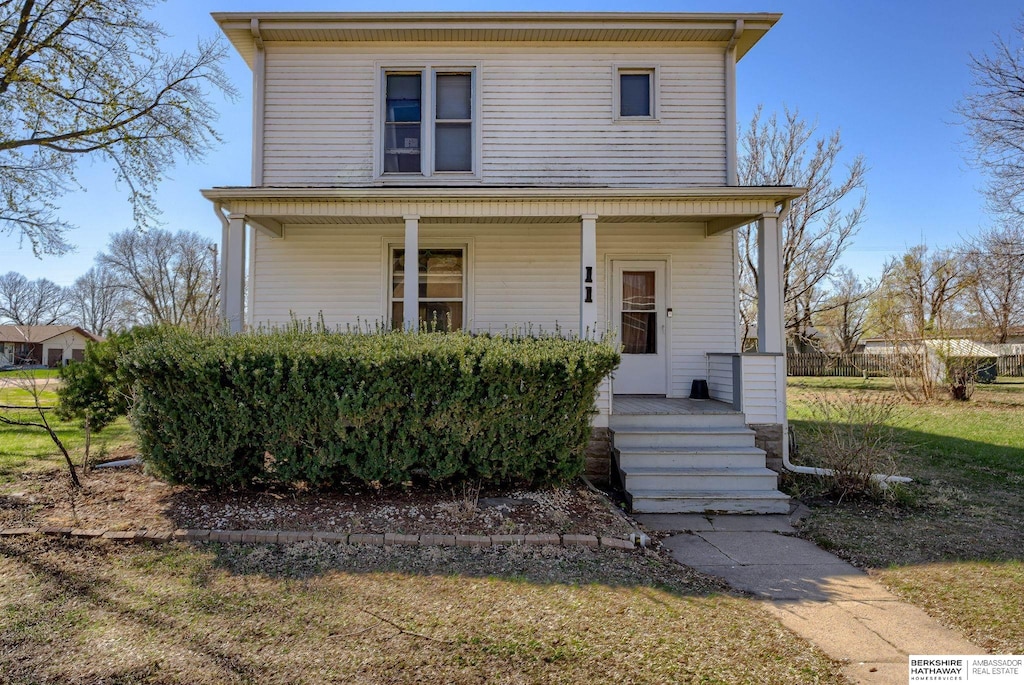 traditional style home with covered porch