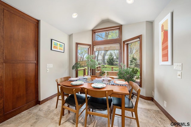 dining area with recessed lighting, vaulted ceiling, and baseboards