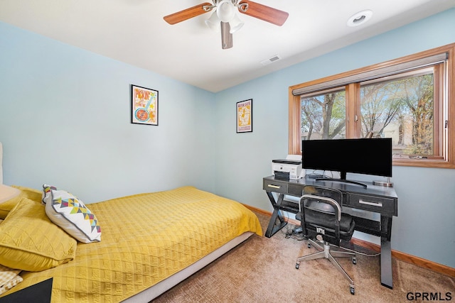 carpeted bedroom featuring visible vents, baseboards, and ceiling fan