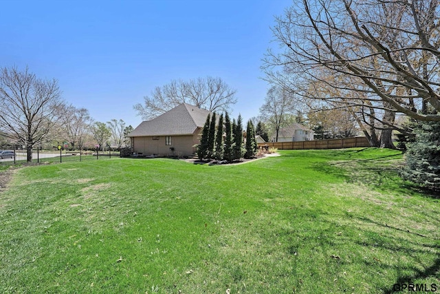 view of yard featuring a fenced backyard