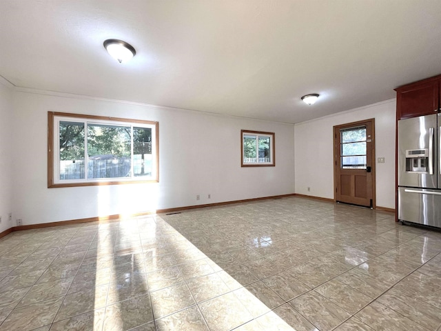 interior space featuring baseboards and ornamental molding