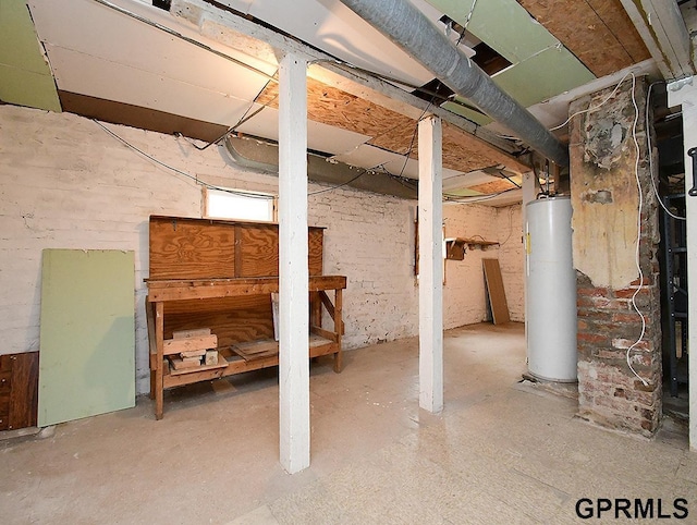 unfinished basement featuring water heater