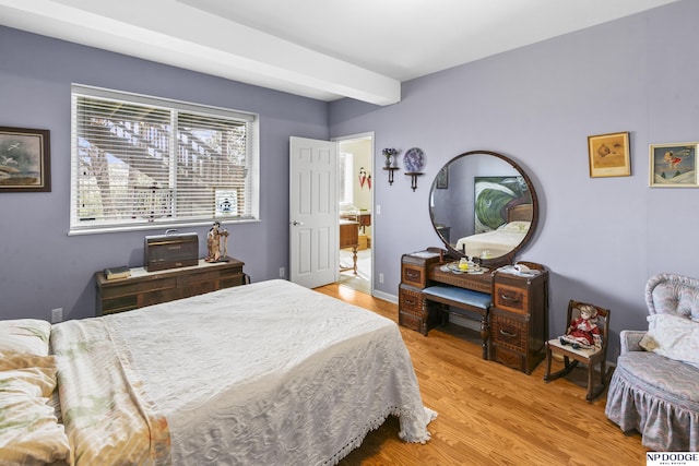 bedroom with light wood finished floors