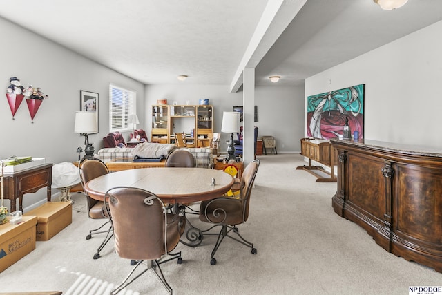 dining space featuring carpet flooring