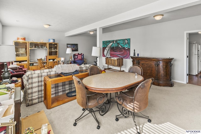 dining area featuring carpet flooring