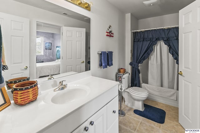 bathroom featuring vanity, tile patterned floors, ensuite bath, toilet, and visible vents