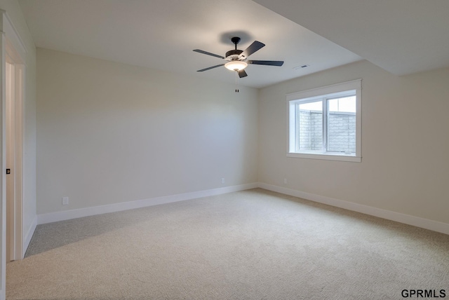 20806 Boulder St, Gretna, NE 68028 - spare room with visible vents, ceiling fan, light carpet, and baseboards