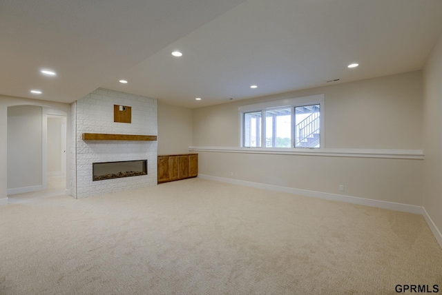20806 Boulder St, Gretna, NE 68028 - unfurnished living room with a fireplace, recessed lighting, light carpet, and baseboards