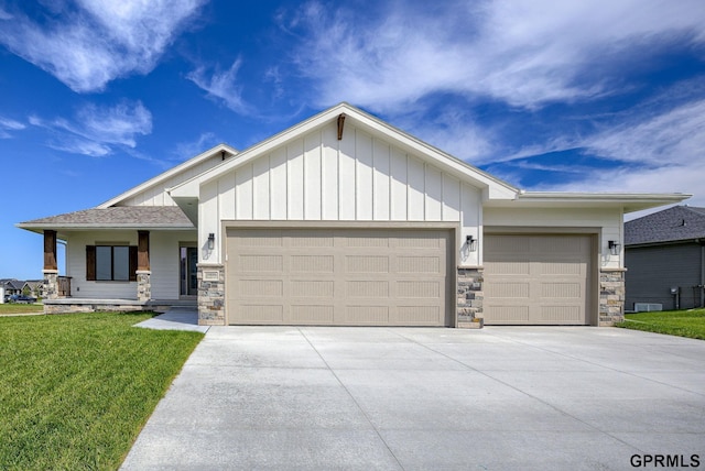 20806 Boulder St, Gretna, NE 68028 - view of front facade with stone siding, board and batten siding, concrete driveway, and an attached garage