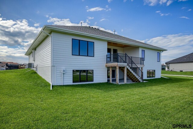 20806 Boulder St, Gretna, NE 68028 - rear view of property with a lawn, stairs, and a wooden deck