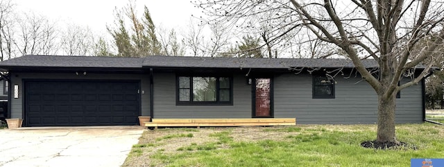 ranch-style home featuring driveway and a garage