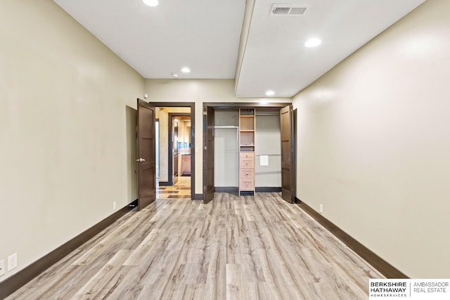 unfurnished bedroom with recessed lighting, visible vents, and light wood-style flooring
