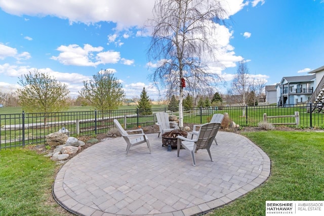 view of patio with a fire pit and fence