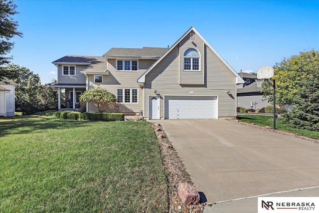 traditional-style house with a front yard, driveway, and an attached garage