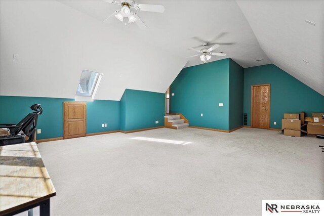 bonus room featuring baseboards, ceiling fan, carpet floors, and vaulted ceiling