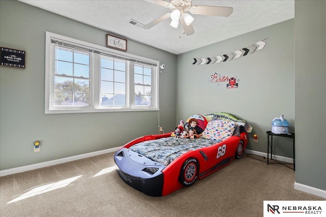 bedroom with baseboards, visible vents, a textured ceiling, and carpet flooring