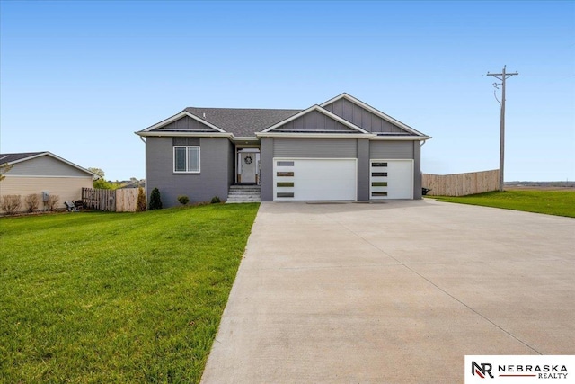 708 Sunset Blvd, Palmyra, NE 68418 - view of front of house featuring driveway, an attached garage, and board and batten siding