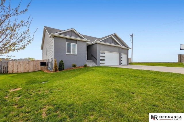 708 Sunset Blvd, Palmyra, NE 68418 - view of front of house featuring driveway, a garage, and board and batten siding