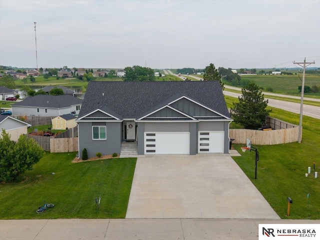 708 Sunset Blvd, Palmyra, NE 68418 - view of front of property featuring a garage and driveway