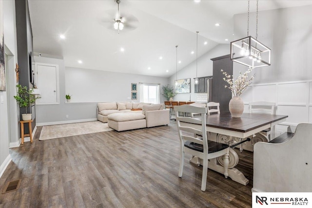 708 Sunset Blvd, Palmyra, NE 68418 - dining room with wood finished floors, a chandelier, recessed lighting, high vaulted ceiling, and baseboards