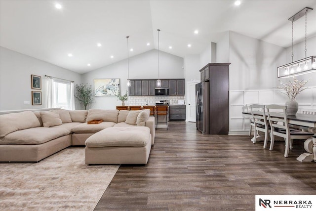 708 Sunset Blvd, Palmyra, NE 68418 - living room with dark wood-style flooring, high vaulted ceiling, and recessed lighting