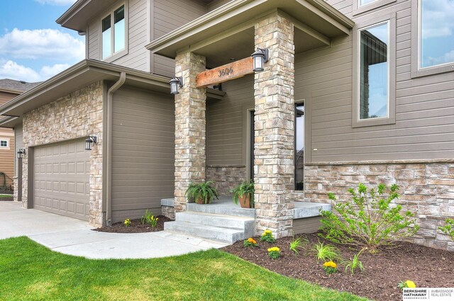 view of home's exterior with a garage, driveway, and stone siding