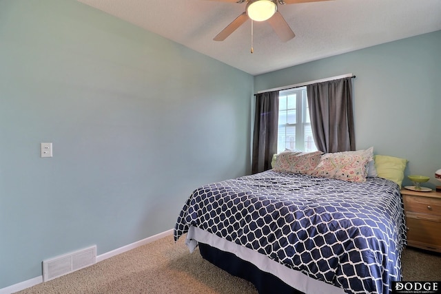 bedroom featuring carpet flooring, baseboards, ceiling fan, and visible vents