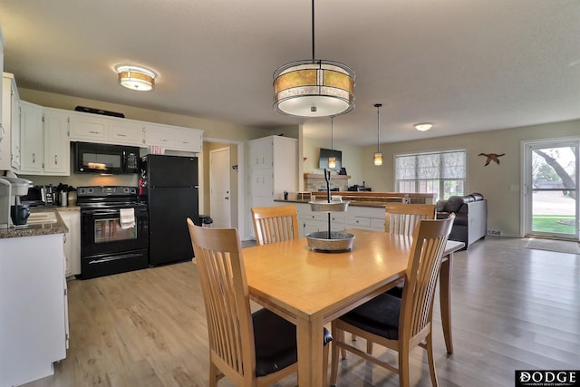 dining room with light wood-style floors