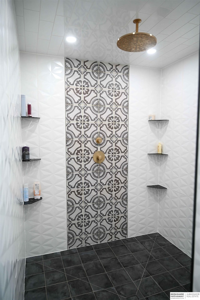 bathroom featuring tile patterned floors, tile walls, recessed lighting, and tiled shower