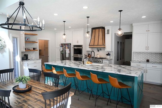 kitchen featuring recessed lighting, open shelves, custom exhaust hood, backsplash, and appliances with stainless steel finishes